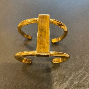 Gold cuff with tiger stone